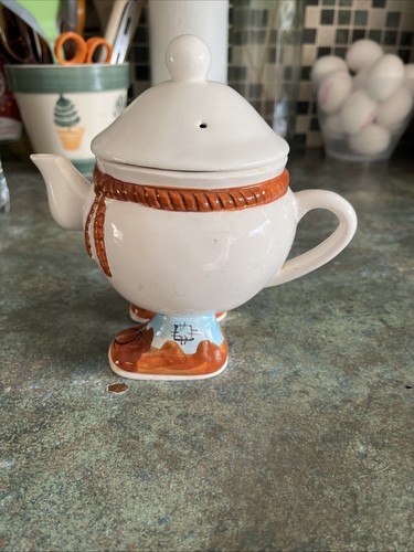 Quirky little tea pot with - little,