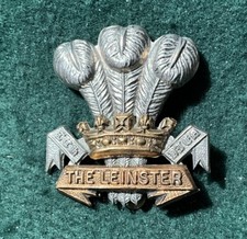 - The Leinster Regiment CAP BADGE - Bimetal with Brass slider .s84