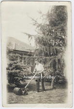 Vintage Photograph of a Lady Using and Pushing a Lawnmower  