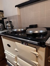 AGA COOKER 2 OVEN DELUXE OIL FIRED IN CREAM. GREAT CONDITION AND FULLY SERVICED!