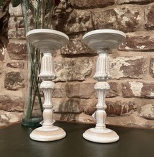 A pair of candle stick holders