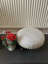 ROUND CLOTH COVERED FOOTSTOOL, CREAM CLOTH WITH BLUE PATTERN, STUD DETAIL EDGE.