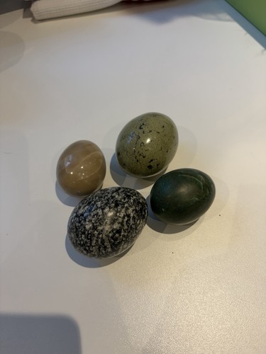 Four alabaster eggs hand - four,
