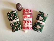 Three Miniature Bolts Of Christmas Fabric