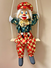 Vintage Wall Hanging Decorative Clown On A Swing Ceramic head with broken ear.
