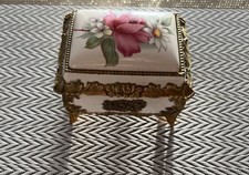 Vintage Sankyo porcelain music box with a floral design
