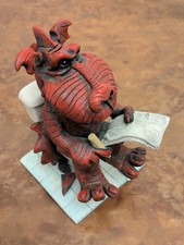 Ceramic Dragon Sitting On