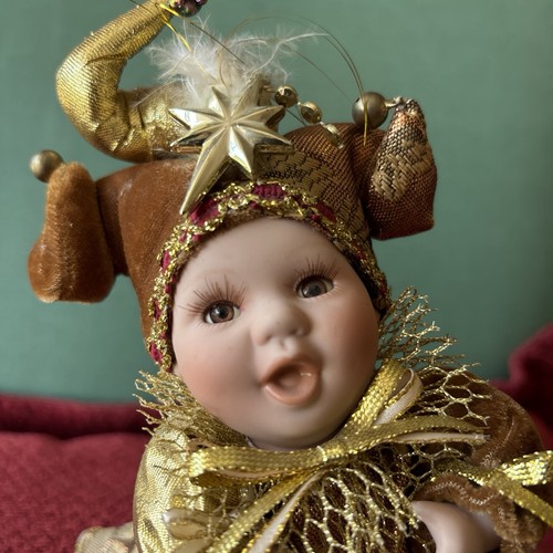 Porcelain baby jester musical - jester,