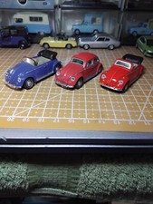 set of four volkswagen beetles