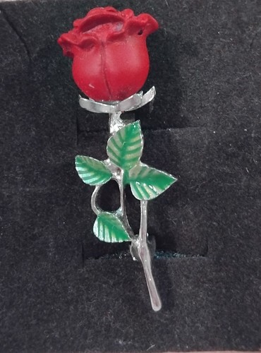 Rose shaped brooch made of - rose-shaped,