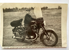 Beautiful boy on a motorcycle