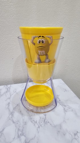 Yellow candy dispenser - m&m’s,