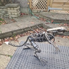 Xenomorph Scrap Metal Sculpture Alien 9" tall 18" long Heavy Item. Beautiful