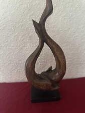 sculpture of dancing dolphins on plinth in shape heart great unusual present