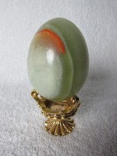 Polished Green Onyx Egg with Orange Inclusion on a Stand