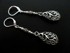 A PAIR OF TIBETAN SILVER