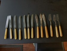 VINTAGE SELECTION OF 13 FAUX BONE HANDLED CUTLERTY PIECES, KNIVES & FORKS