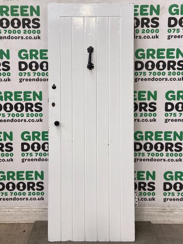 Narrow wooden front door - front,