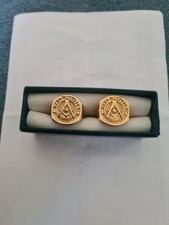 TWO YELLOW METAL MASONIC SIGNET RINGS.