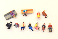 SEATED CIVILIAN FIGURES