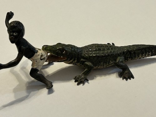 Alligator boy figurine - &,