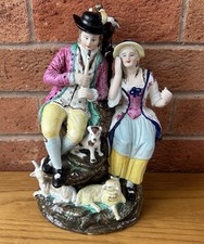 Staffordshire figure Shepherd and shepherdess Dog Lamb And Goat pastoral scene. 