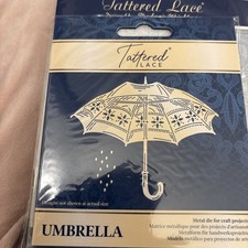 Tattered lace die ‘umbrella’ used once 
