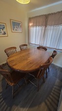 Dining table oval shaped made of  solid oak  vintage  with 6 chairs 