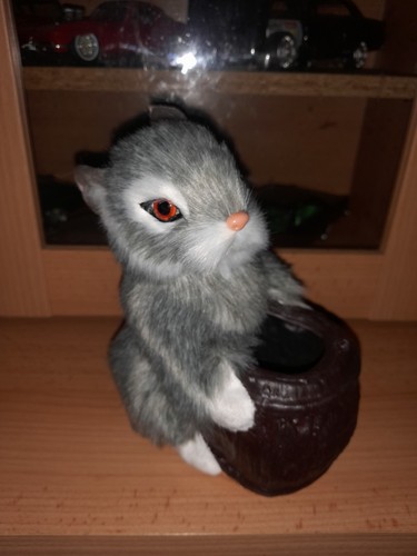 Fake taxidermy rabbit holding - fake,