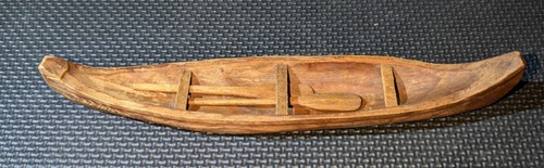 Hand carved wooden canoe lands - hand,