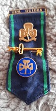 vintage Girl Guides Leader's ribbon with vintage promise badge, world badge and