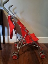 Red foldable Babies"r"us travel pram