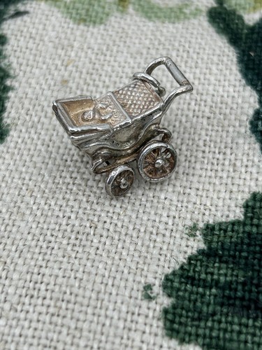 Vintage silver baby pram - baby, in