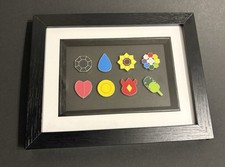 1 x Framed Set of Pokemon Gym Badges. Choose your Region
