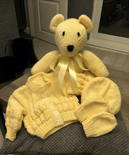 Hand knitted yellow teddy