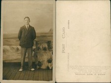 While U Wait Studios of Blackpool Man Suit by Waves Backdrop