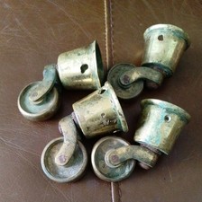 4round solid brass - casters, old