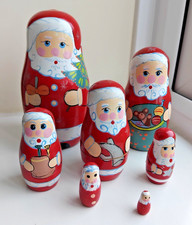 WOODEN FATHER CHRISTMAS NESTING/RUSSIAN  DOLLS - 7 PIECES