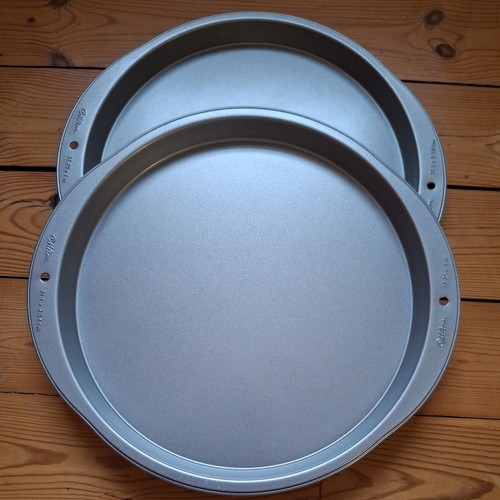 Two wilton pizza cookie pans - wilton,