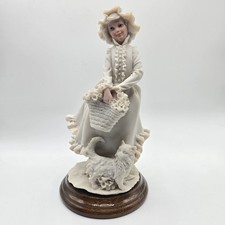 A Belcari Girl Figurine with