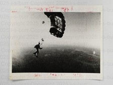 Parachuting Skydiver In Mid