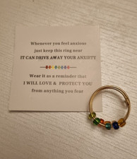 Worry/ fidget ring - multicoloured bead on gold coloured metal