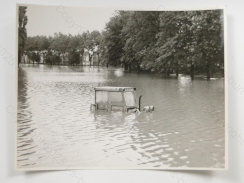 Tractor submerged flood water - submerged,
