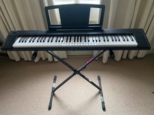 Electric piano with stand