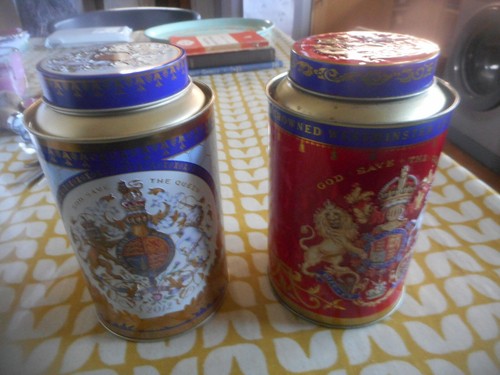 Two old tea - , tins,