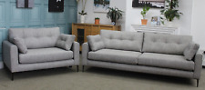 DFS MAYA 4 SEATER SOFA AND SNUGGLE CHAIR IN GREY WEAVE FABRIC.