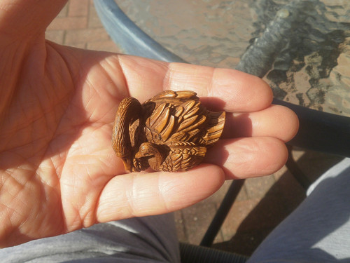 Hand carved wood netsuke - of, a
