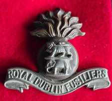 Royal Dublin Fusiliers. British Military Bi Metal Cap Badge, Slider