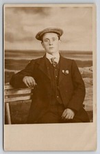 RPPC Young Man On Bench Seaside Ocean View Studio Prop Scene Postcard M25