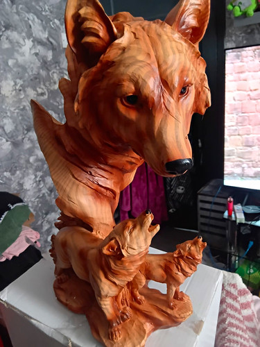 Hand carved wooden wolf - hand,